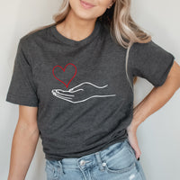 Hand Holding Heart Graphic Tee | Scatter Kindness | Be Positive | Kindness | Be Kind