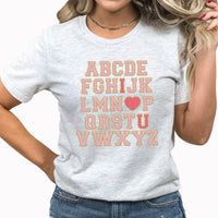 Alphabet I Love You Graphic Tee | Faux Chenille | Fri-Yay Teacher | School | Valentines |  I Heart You | Pink | Printed Tee | Laying Tee